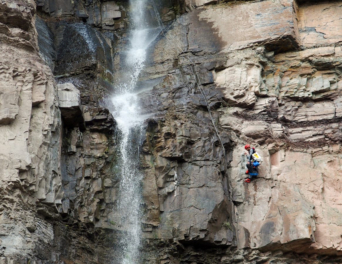 Climber rapelling down Lower Cascade Falls